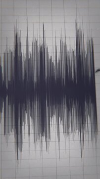 Seismograph Record of an Earthquake on old paper. Hd 3d animation video showing a close-up shot of the seismograph pen	in vertical format 
