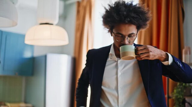 Business man drinking coffee leaving home for work. Freelancer checks phone