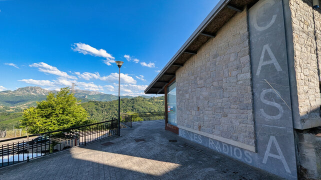 Exterior view of the House of Radios Museum in Bimenes, Asturias, surrounded by green hills and rural scenery in the Cider Region of northern Spain