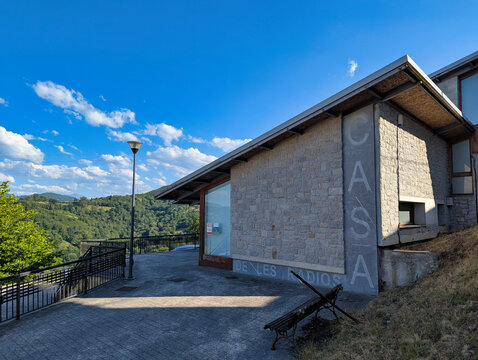 Exterior view of the House of Radios Museum in Bimenes, Asturias, surrounded by green hills and rural scenery in the Cider Region of northern Spain