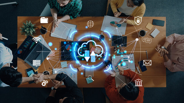Modern Team Collaboration with Cloud Technology and Data Visualization in a Business Meeting Setting. Sentient.