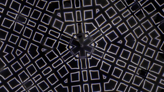 Geometric patterns in black and white tiles on a ceiling
