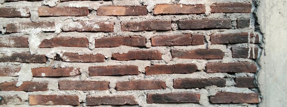 Industrial style red brick wall with concrete frame