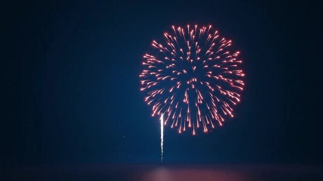 A bright blue firework explodes against a dark night sky background