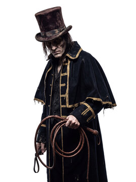 Scary Victorian Villain Character in Top Hat and Tattered Coat Holding a Whip Isolated