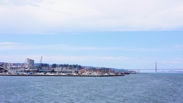 Panning across San Francisco waterfront toward Golden Gate Bridge