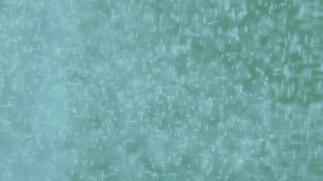 Clear Water Bubbles Slowly Ascending in Patina Blue Liquid - Clean Motion Background