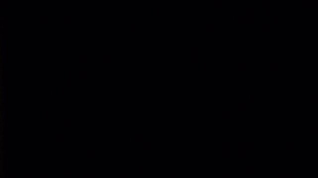 Abstract dark brown and black gradient background texture.