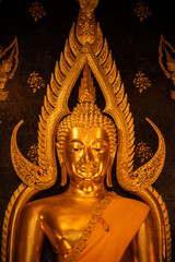 Fototapeta premium Close up of beautiful golden Buddha situated in Wat Phra Sri Rattana Mahathat temple in Phitsanulok province of Thailand.