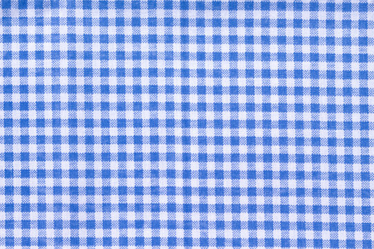 Bright blue gingham fabric, flat lay