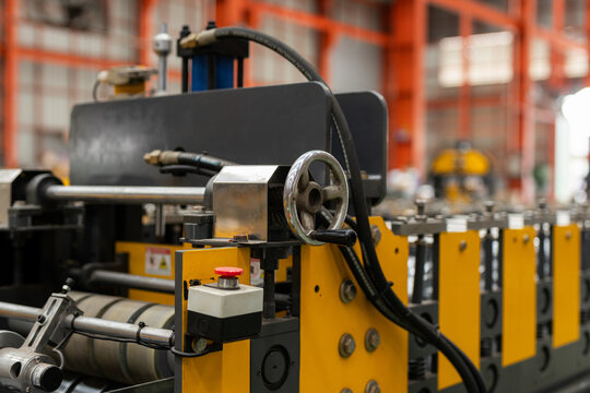 Powerful industrial machine shaping metal sheet in productive factory environment capturing dynamic concept of modern manufacturing and heavy equipment engineering working efficiently