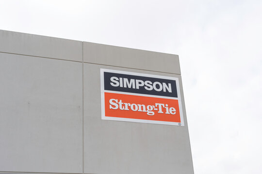 Houston, TX, USA - March 6, 2022: Simpson Strong Tie brand sign installed on a building in Houston, TX, USA. Simpson Strong Tie is a manufacturer of structural solutions, including connectors and fast