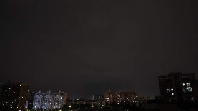 Lightning flashes through dark storm clouds. Black clouds before the thunderstorm. Perfect super slow motion footage, loop able b roll video. 