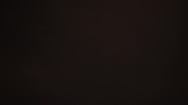 Lightning flashes through dark storm clouds. Black clouds before the thunderstorm. Perfect super slow motion footage, loop able b roll video. 