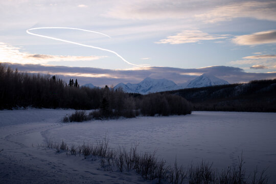 Mountains behind frozen lake in Alaska