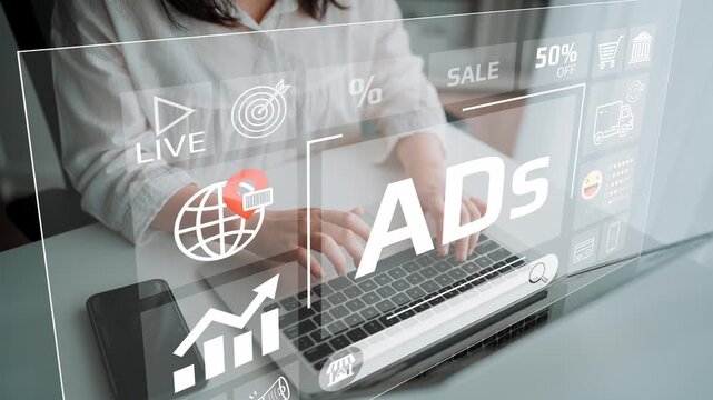 Digital Marketing and Advertising Strategy with Hands Typing on Laptop Amidst Overlay of Graphs and Icons for Online Business Promotion. Entropy.