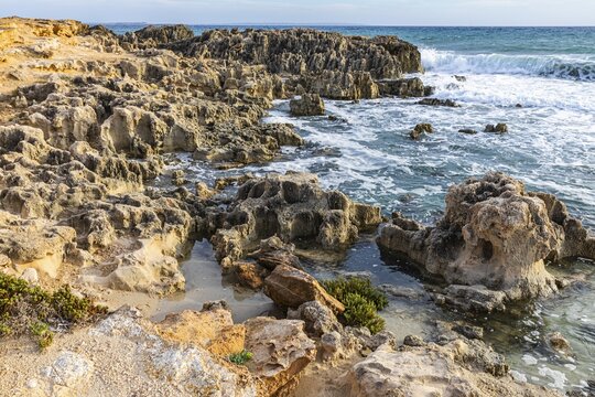 Eroded rocks on the beach of Salines, Ibiza, Balearic Islands, Mediterranean Sea, Spain