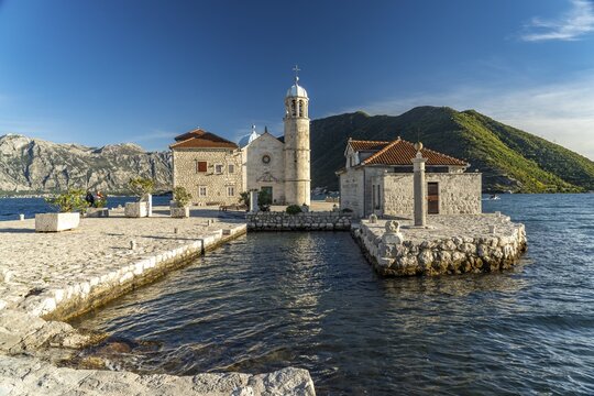 The artificial island of Gospa od Skrpjela with the church of St. Mary on the rock near Perast on the Bay of Kotor, Montenegro