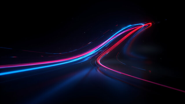 Abstract motion blurred streaks of light in red and blue colors moving across dark background representing high speed.