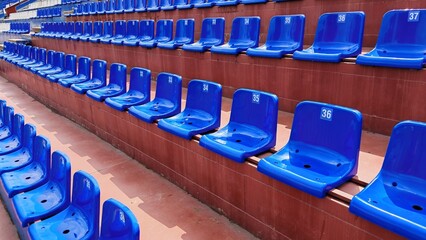 Fototapeta premium Blue stadium seats in a football arena