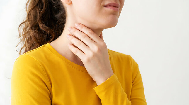 Woman touching throat experiencing discomfort