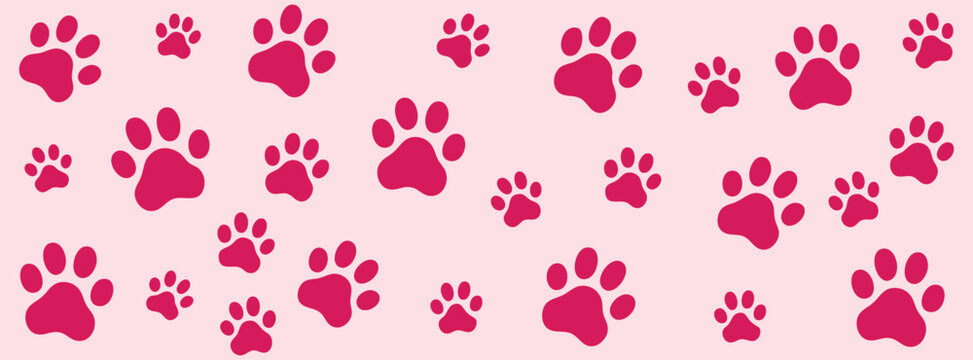 Seamless pattern with pink paw prints on a light pink background