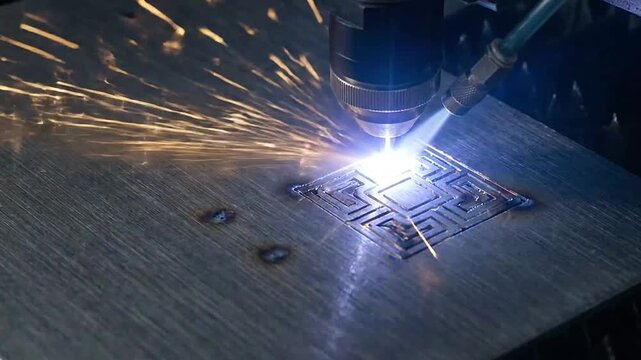 A high precision industrial laser cutting a geometric pattern into a metal sheet