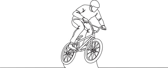 Fototapeta premium BMX rider performing a stunt, showcasing skill and athleticism on a bicycle.