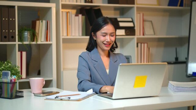 Excited Female Employee Reacts to Salary Increase or Bonus Notification on Laptop at Office Desk