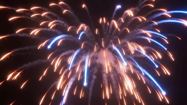Burning firework fuse exploding with bright sparks in dramatic slow motion close-up