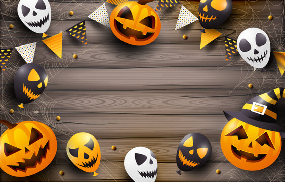 Halloween pumpkins and skulls on wooden fence