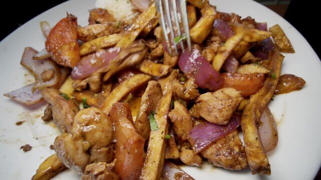 Picking up french fries from Pollo Saltado