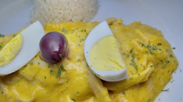 Aji de Gallina served on a bed of rice. Typical Peruvian food