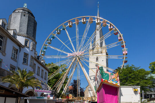 Menden sauerland funfair ferris wheel and st vincenz church