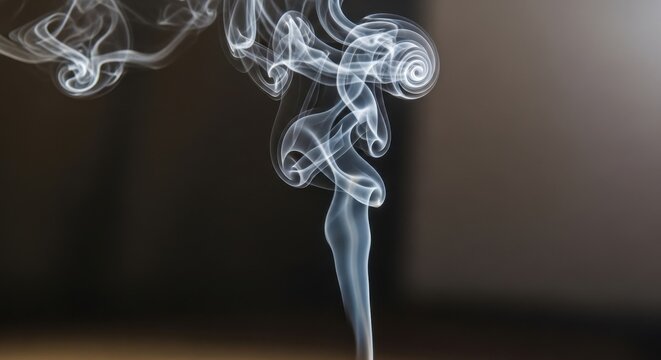 Delicate wisps of smoke swirling in abstract patterns