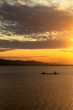 Kayakers on Water During Sunset