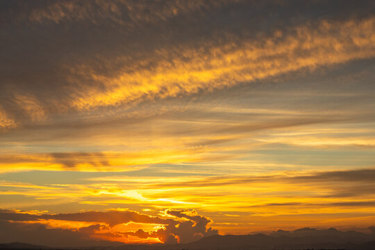 Golden Sunset Sky with Wispy Clouds