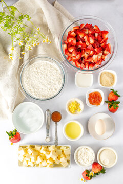 Ingredients for a strawberry baking recipe flat lay