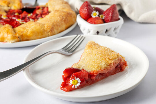 Delicious slice of rustic strawberry galette with chamomile