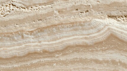 Obraz premium Close-up of a textured surface. the surface appears to be made of a light-colored material, possibly stone or marble, with a rough, uneven texture.