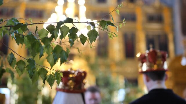Russian Orthodox wedding ceremony with birch leaves and crowning ritual