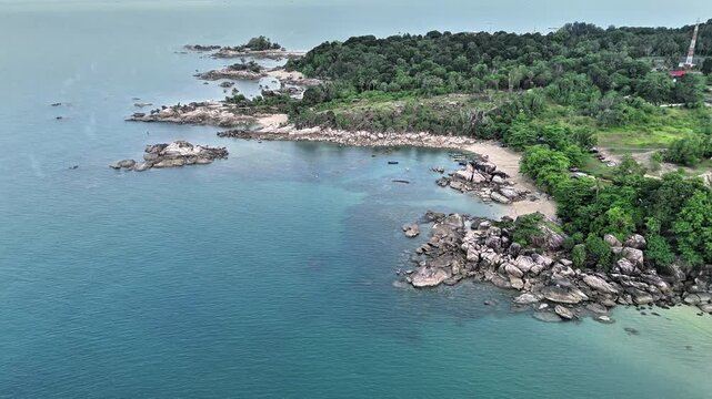 Aerial Drone View of Turun Aban Beach Bangka Revealing Granite Headlands Crystal Blue Waters Hidden Tropical Bays and Peaceful Coastal Beauty
