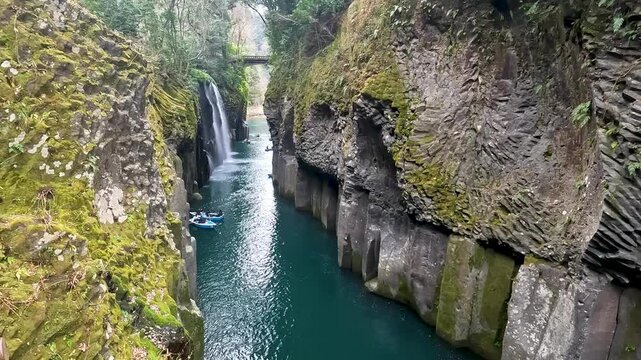 Landscape Takachiho Gorge is River canyon with waterfalls over sheer basalt cliffs viewable from rented boats and a paved path in Takachiho Miyazaki Kyushu Japan - Footage Clip Travel Nature