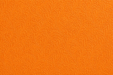 Naklejka premium orange embossed paper texture with an elegant floral damask pattern and matte finish. Premium decorative paper ideal for packaging, stationery, book covers, invitations, and luxury backgrounds.
