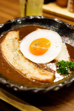 Japanese curry rice dish with thick and spiced sauce pairing with variety of meat.