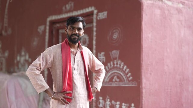 Young indian farmer standing at home 