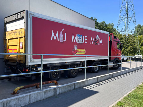 Branded Biedronka delivery truck parked beside a supermarket loading area in Gdynia, Poland July 16, 2026