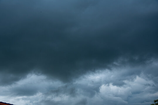 Dark cloudscape storm disaster gloomy gray cloud sky. Meteorology danger windstorm disasters climate. Dramatic dark storm rain clouds black sky background. Dark thunderstorm clouds rainny atmosphere