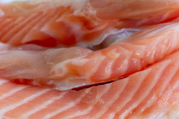 Fototapeta premium Fresh salmon fillets presenting healthy seafood choice for cooking Rich in protein ready for culinary preparation.