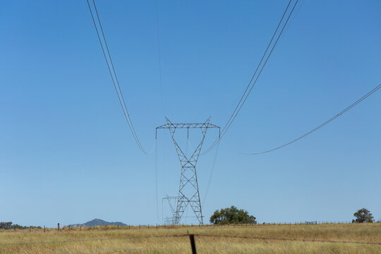 transmission tower electricity pylons in rural Australia transporting power through country